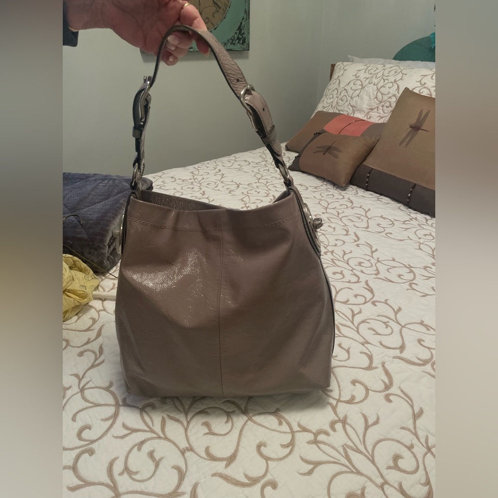 Coach purse. In excellent used condition. Taupe. Patent leather